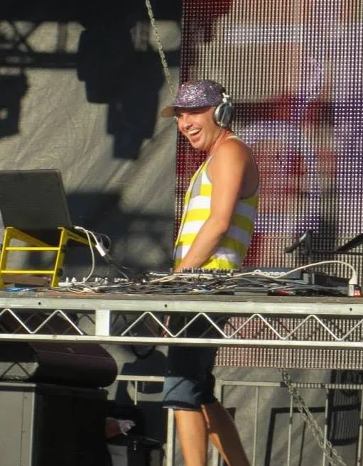 DJ Will Z performing on an outdoor stage