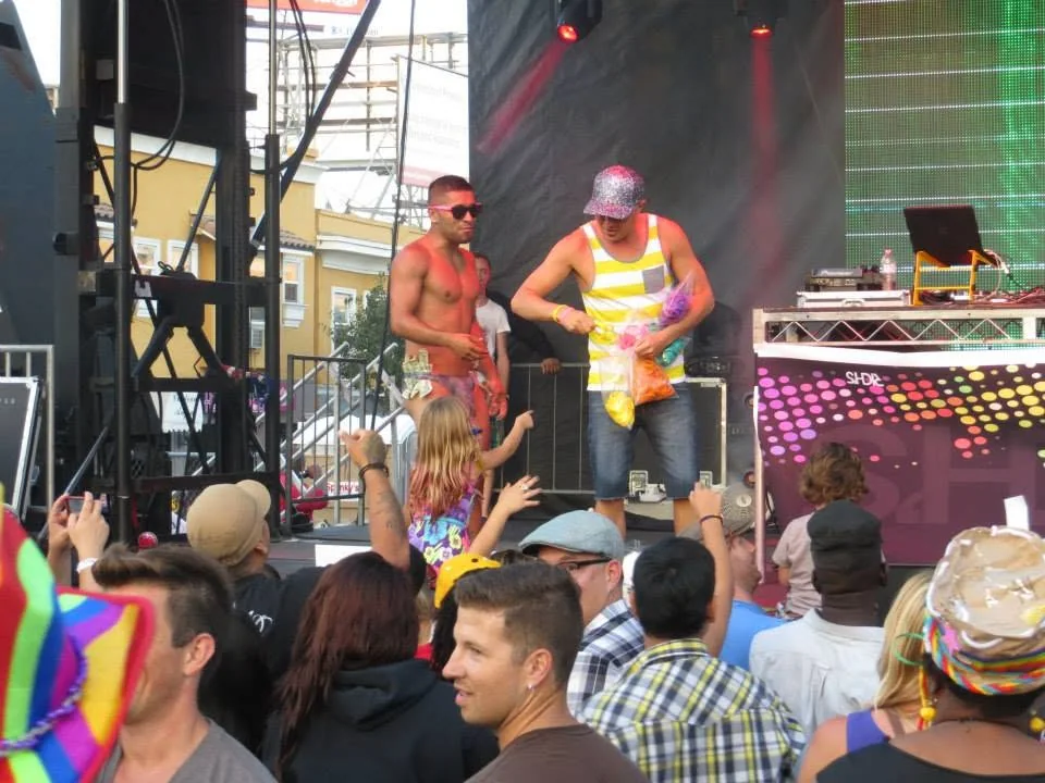 Wide view of DJ Will Z and performers on a Pride stage
