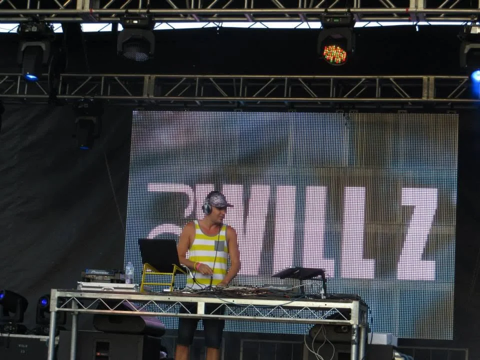DJ Will Z performing on a large outdoor Pride stage