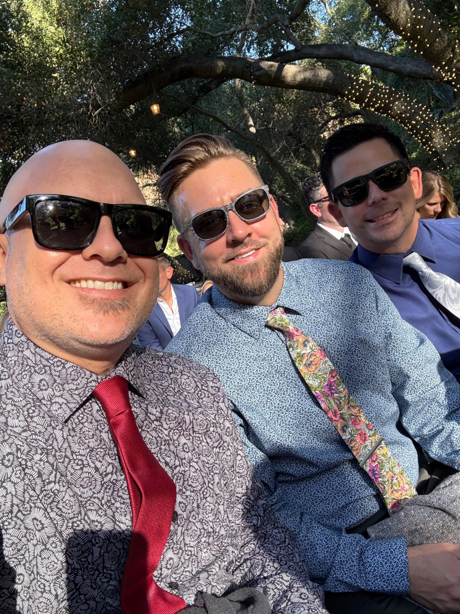 William, Caleb and Daniel together at an outdoor celebration